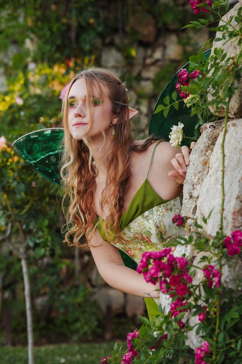 Fairy editorial in a rose garden